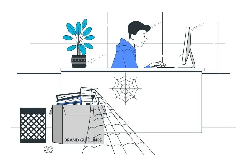 Man at desk with spider web on the brand guidelines