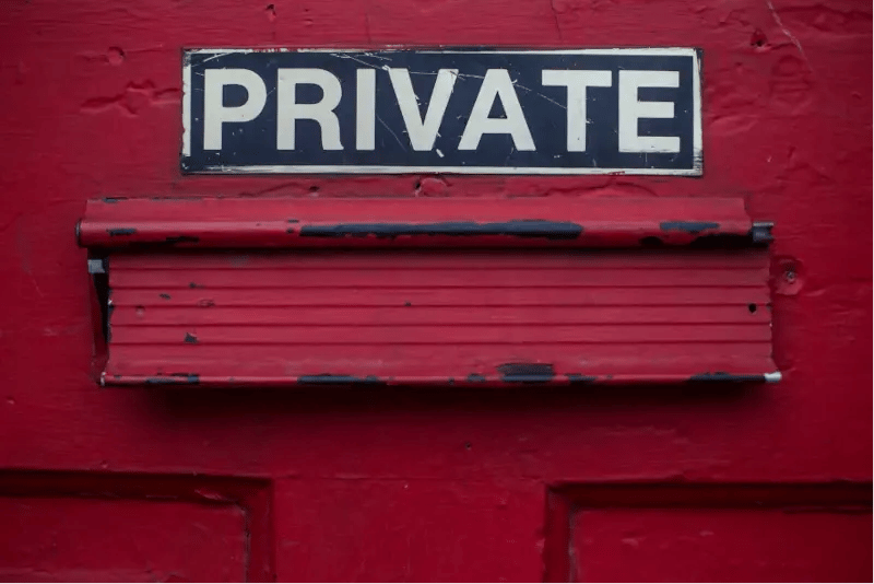 "private" sign above red mailbox