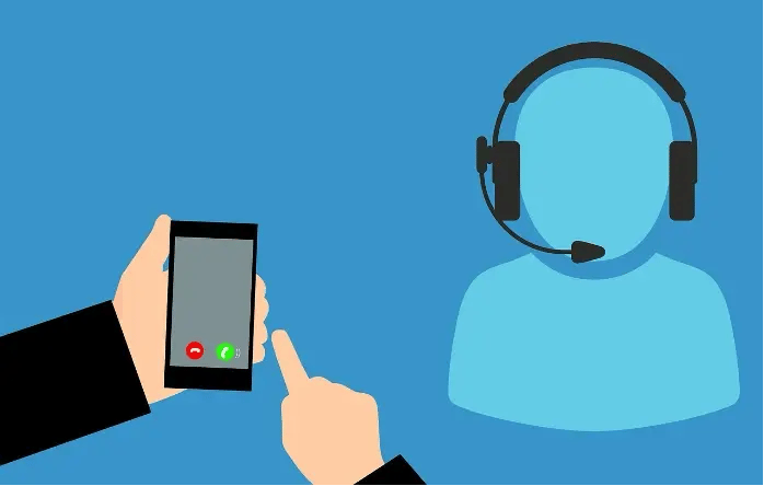 Ringing cell phone next to figure with headset