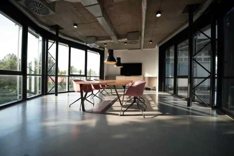 A room with a table and chairs