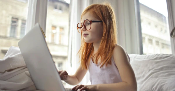 Little girl in front of laptop